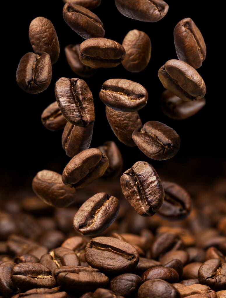 falling coffee beans dark with copy space